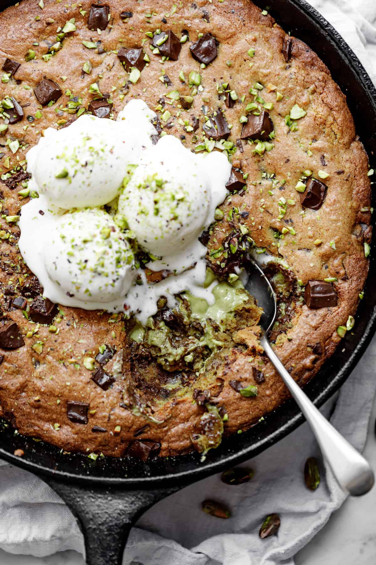 Indulge in a Decadent Pistachio Skillet Cookie with Cherry